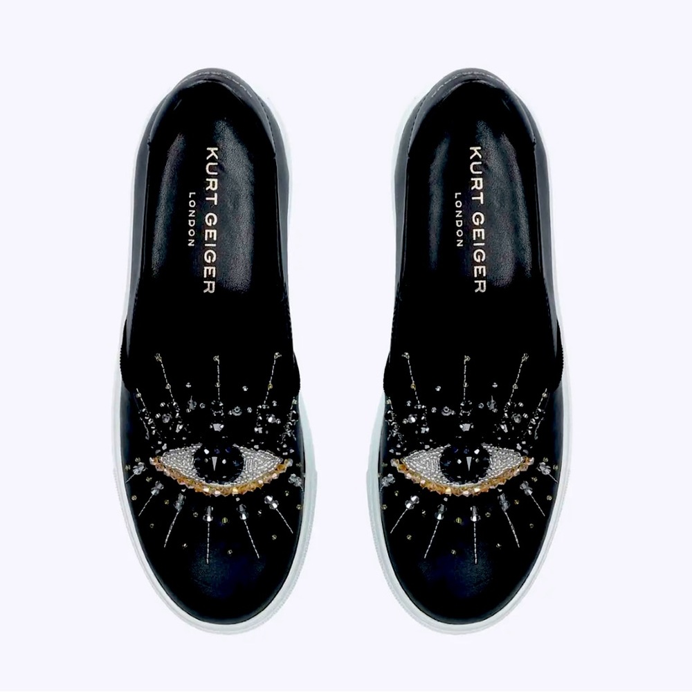 KURT GEIGER
The Leah Eye sneaker slips on in black leather.